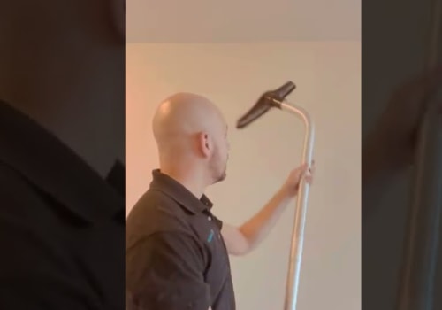 How do you remove construction dust from painted walls?